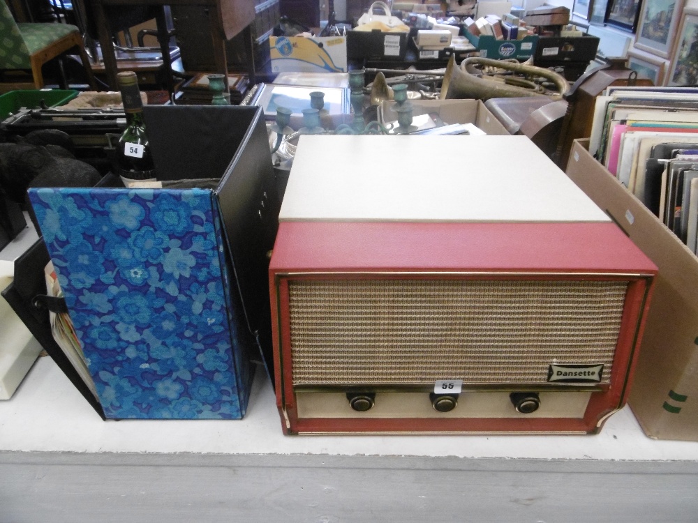 A vintage Dansette conquest record player and an assortment of 45 rpm records 1950s-1980s