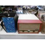 A vintage Dansette conquest record player and an assortment of 45 rpm records 1950s-1980s
