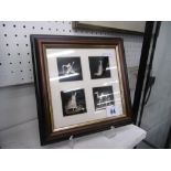 A framed and glazed set of white metal items