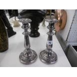 A PAIR OF 19TH CENTURY SILVER PLATED CANDLESTICKS