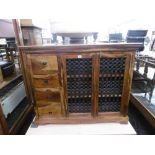 A modern sideboard with metal grill door