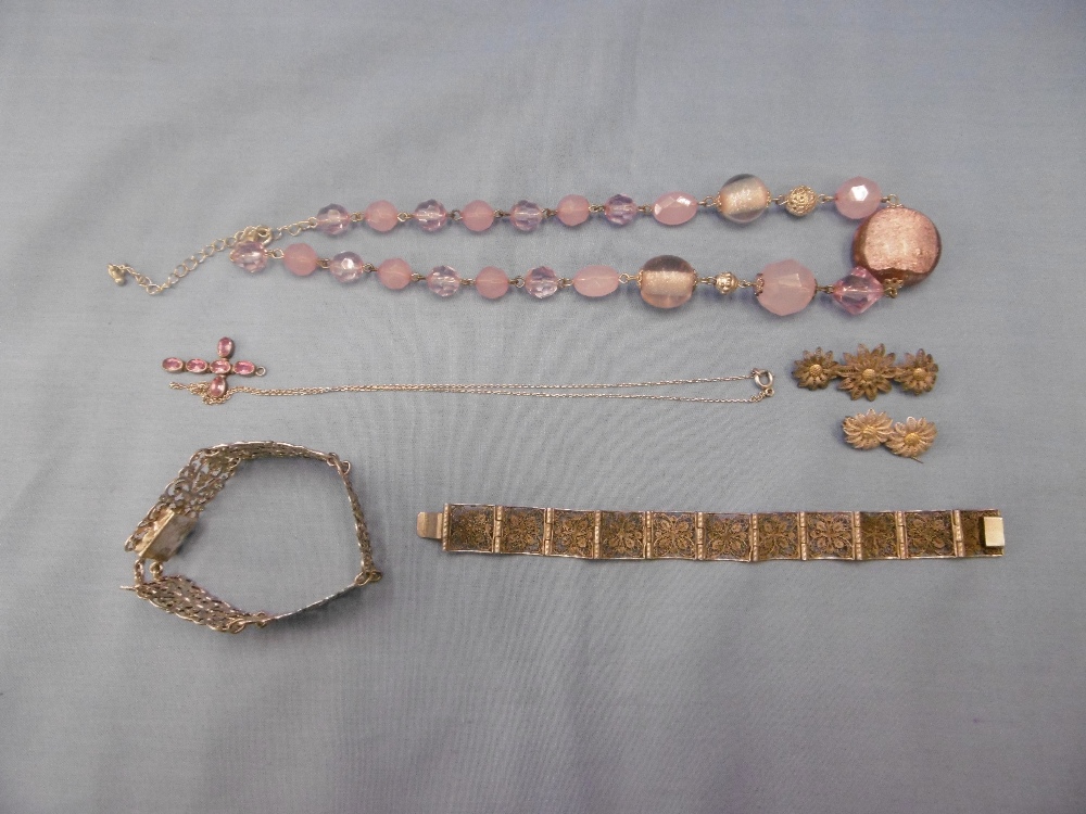 Five items of silver jewellery including two bracelets