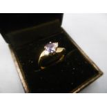 An 18ct gold sapphire and diamond three stone ring size m