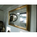 A gilt framed mirror