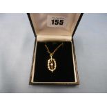 A 9ct yellow gold garnet and pearl pendant on unmarked chain