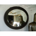 Two oval framed mirrors plus another