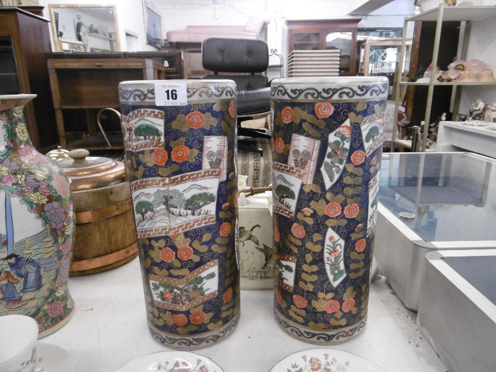 A pair of cylindrical Imari style vases