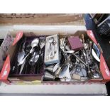 A box of assorted flatware