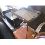 A metal tray table