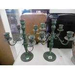 A pair of verdigris five branch candelabra's bras