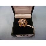 A 9ct gold pearl and amethyst cluster ring size m