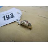 An Edwardian 18ct gold, ruby and diamond three stone ring, Birmingham 1908,