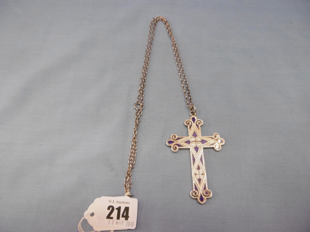 A white metal and blue enamel cross on sterling silver chain,