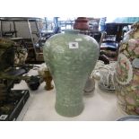 A decorative green vase