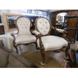 Two carved walnut framed Victorian nursing chairs