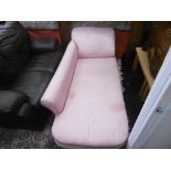A chaise lounge, pink upholstery,