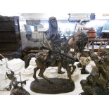 A bronze sculpture of an Arabian horseman
