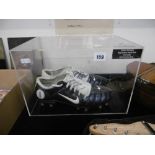 A pair of 'Paul Robinson' football boots,