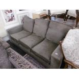 A brown three seater sofa