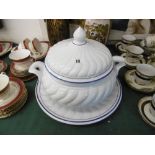 A large ceramic soup tureen