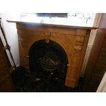 A cast iron Victorian fire place with pine surround with Kite mark