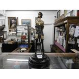 A small bronze sculpture "Miss Whiplash"