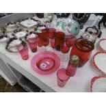 A quantity of cranberry glassware,