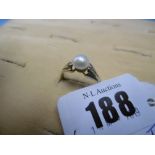 14ct gold and pearl set solitaire ring,