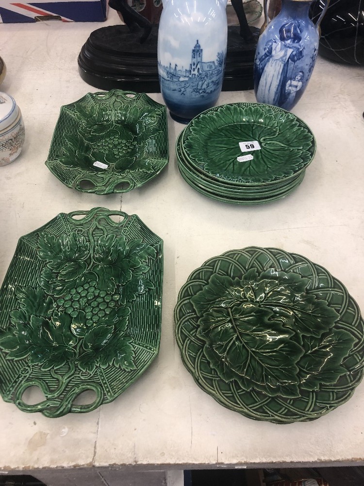 A quantity of 19th century green Majolica salad dishes including Davenport and Wedgewood