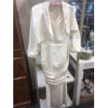 A vintage Ronald Joyce size 12 pure silk wedding dress