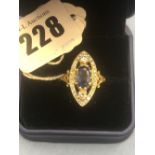 An 18ct yellow gold diamond and sapphire marquise shaped cluster ring size N