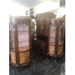 A pair of continental marquetry inlaid vitrine display cabinets