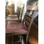 A set of four 19th century inlaid mahogany ladder back chairs