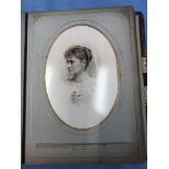 A Victorian leather bound photo album with over thirty cabinet photographs of British Royal family
