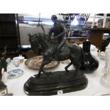 A bronze sculpture of a jockey and horse