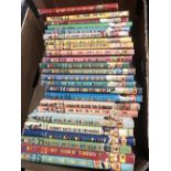 A set of twenty four early Enid Blyton noody books with dust covers