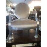 A peach upholstered armchair