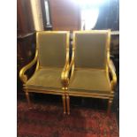 A pair of gilt armchairs