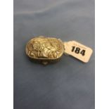 An Egyptian white metal pill box with pharaoh