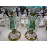 A pair of green and gilt overlay lustre's