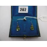 A pair peridot and diamond floral earrings