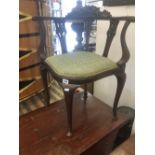 A carved Edwardian mahogany corner chair