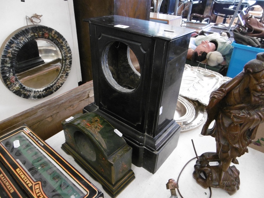 A marble and lacquer clock case