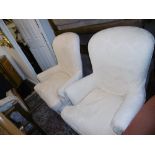 A pair of upholstered armchairs