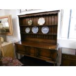 AN OAK DRESSER (CIRCA 1920) STAMPED MAPLES ON BACK, 152X190CM APPROX.