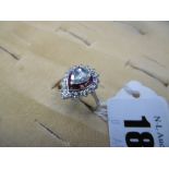 An white metal marked 18ct diamond and ruby ring, centre rose cut diamond 0.