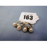 A pair of silver and baroc pearl earrings