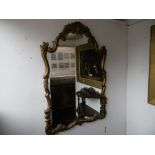 An early 20th Century ornate gilt framed mirror
