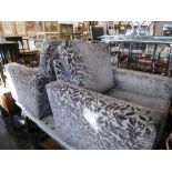 A pair of upholstered armchairs