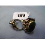 Two silver rings, set with stones,